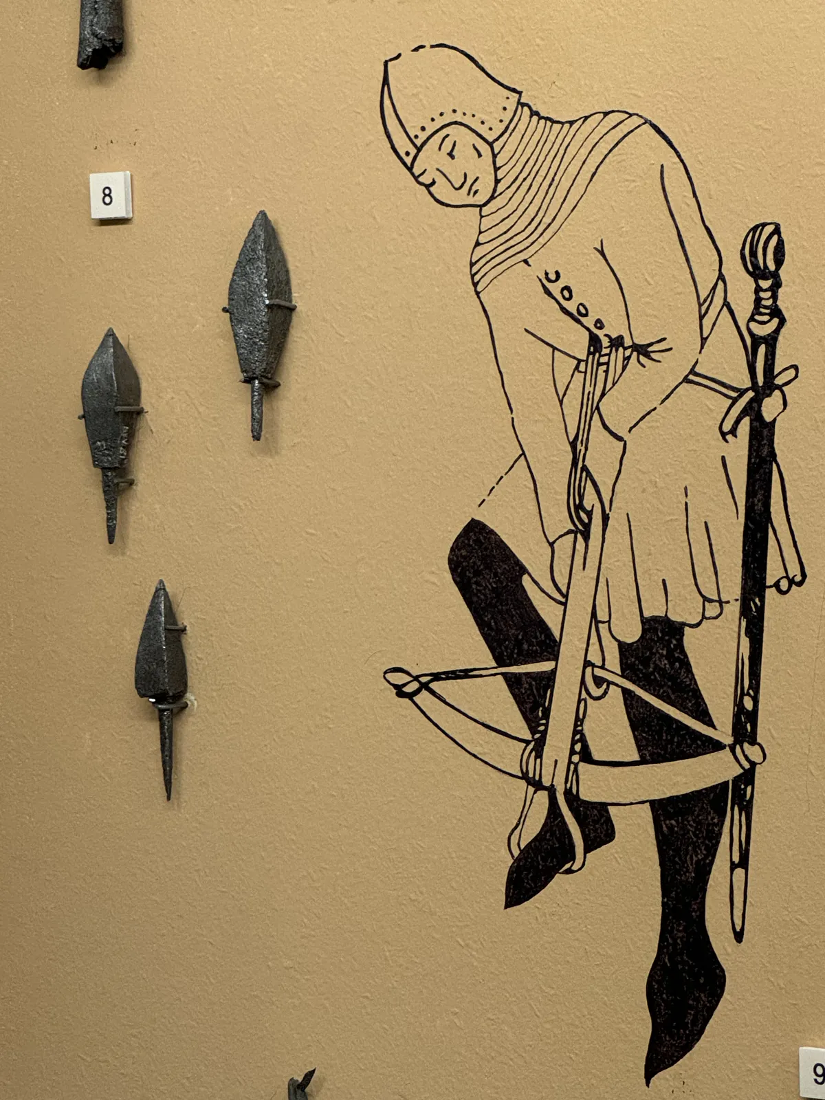 Arbalétrier médiéval et pointes de flèches