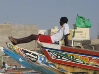 Boy Resting on a Fishing Pirogue