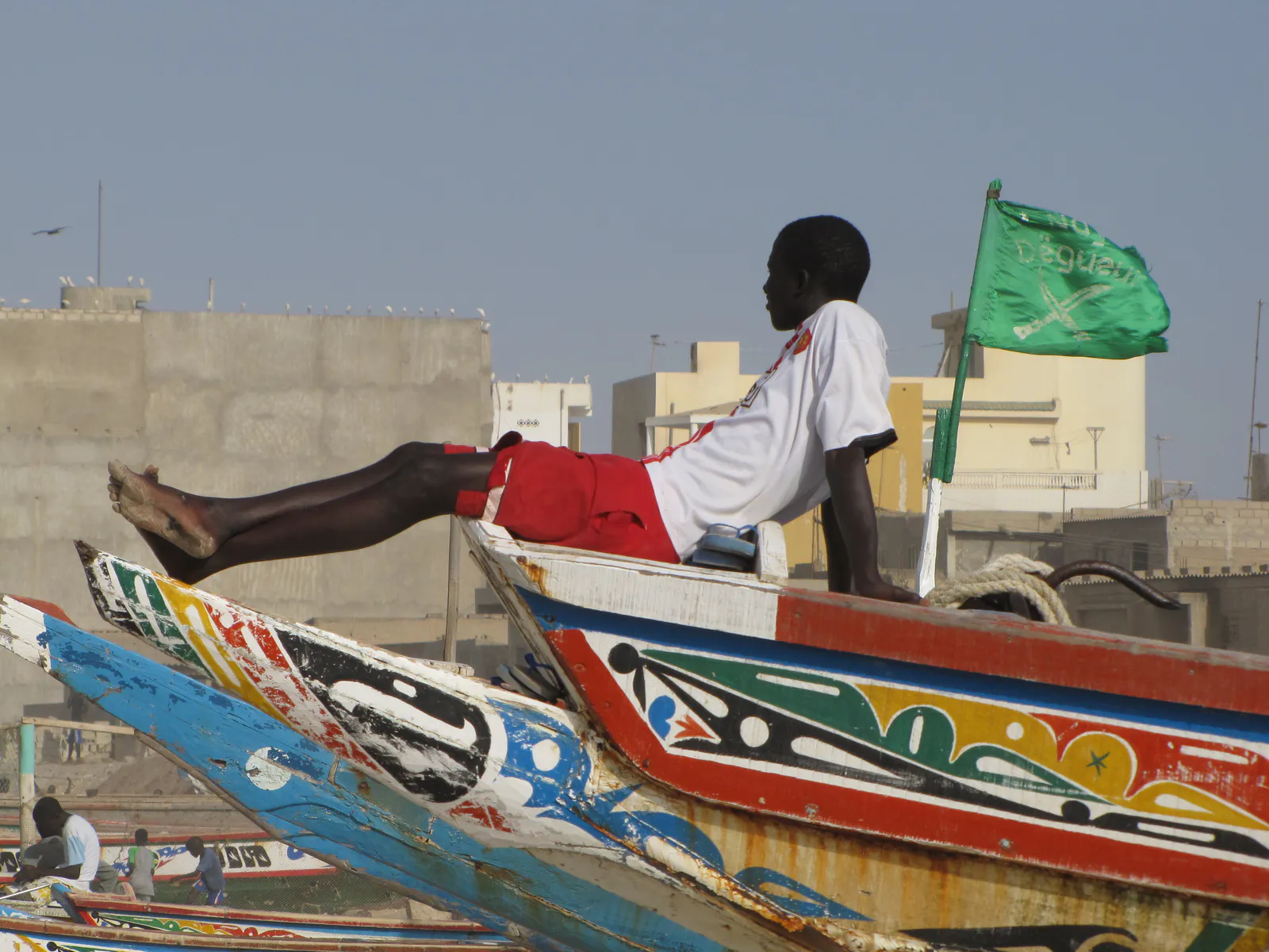Boy Resting on a Fishing Pirogue