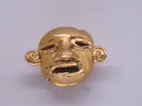 Ancient Gold Earring with Human Head