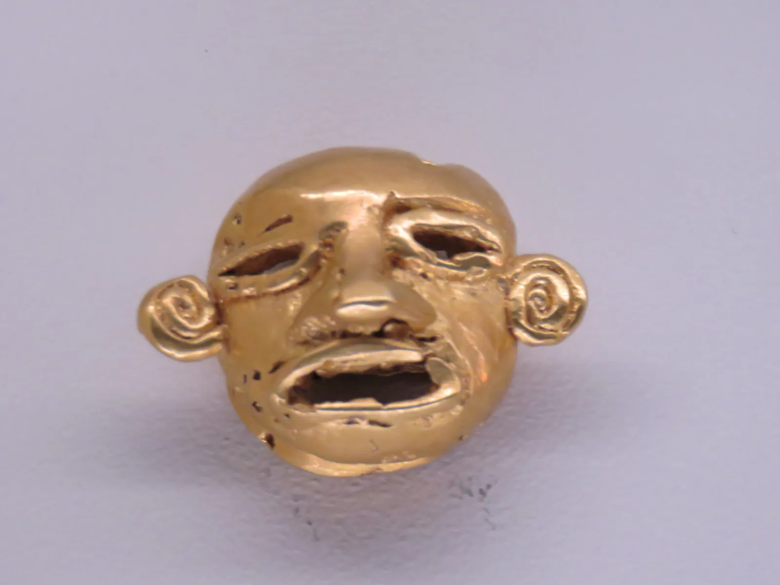 Ancient Gold Earring with Human Head