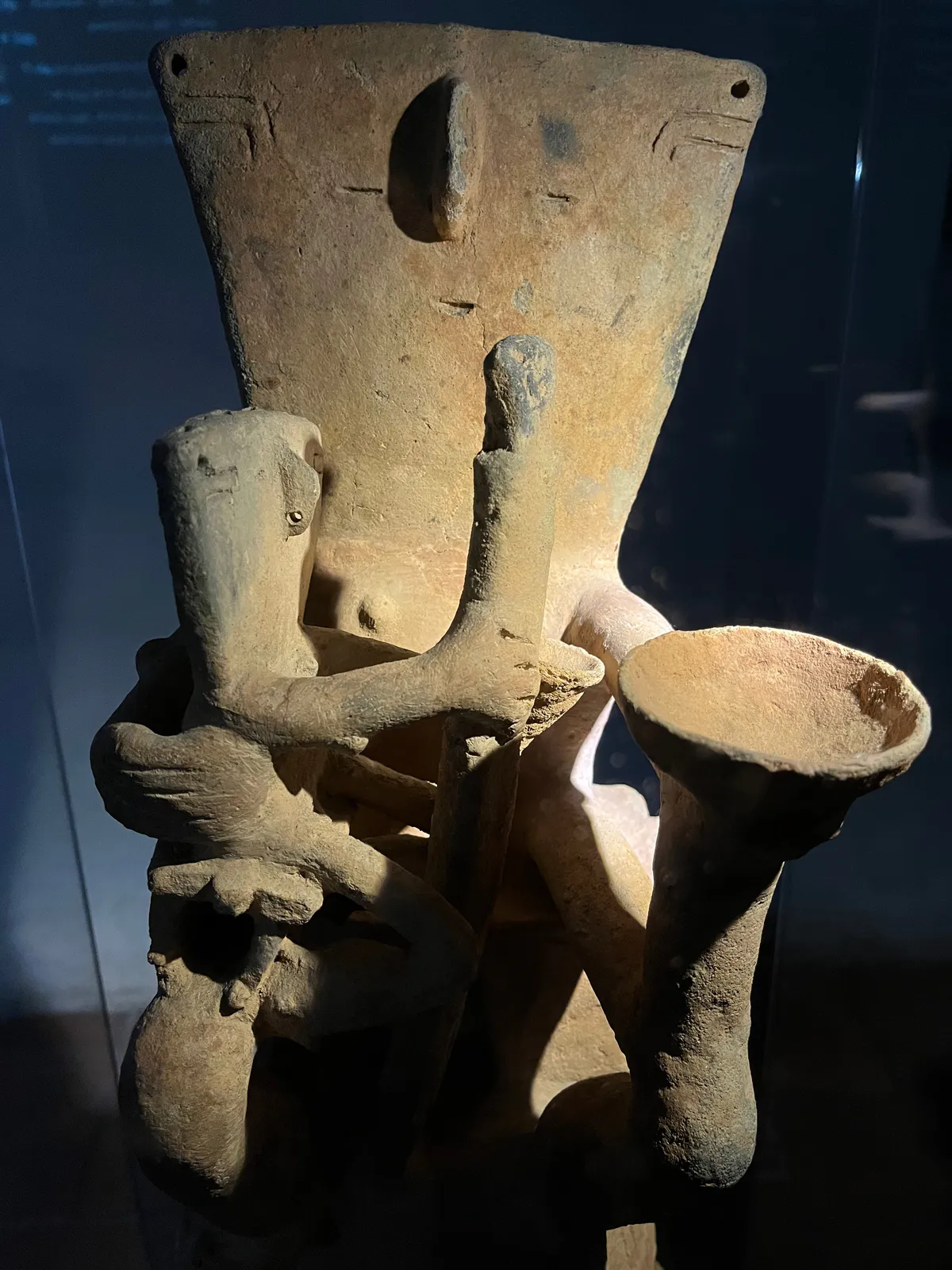 Seated Figure with Cup and Staff