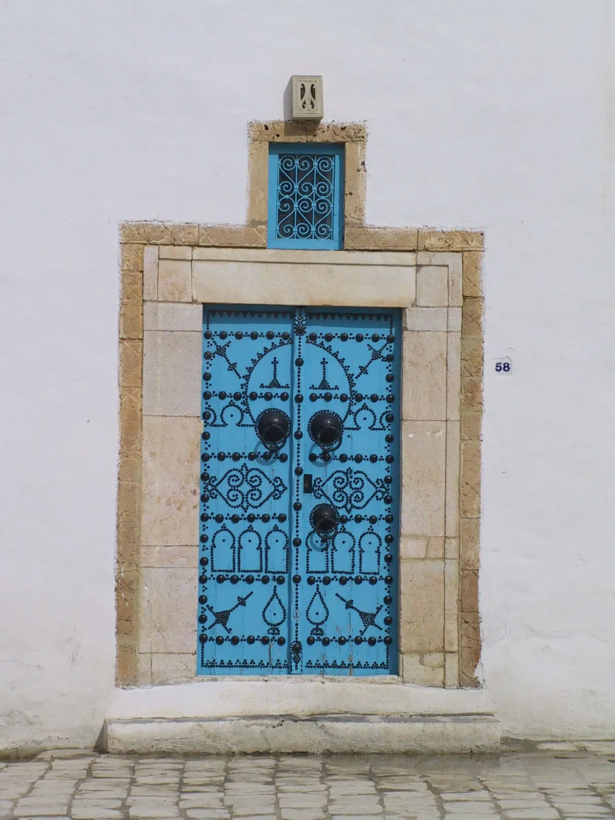 Blue Door with Nailhead Ornamentation
